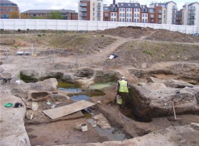 Figure 1. The remains of a late 10th century sunken building (left) and cess pits (right and rear)