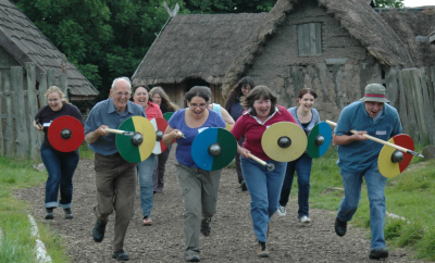 Figure 1: YAC adult volunteers defending a settlement on a Leaders’ Weekend at Murton Park (Image Copyright: YAC)