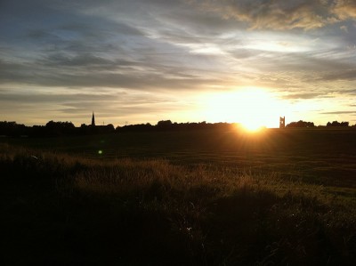 Figure 1. Trim at sunset viewed from the River Boyne. Yellow Steeple and St. Patrick's Cathedral shown in the background (Image: Author's own).